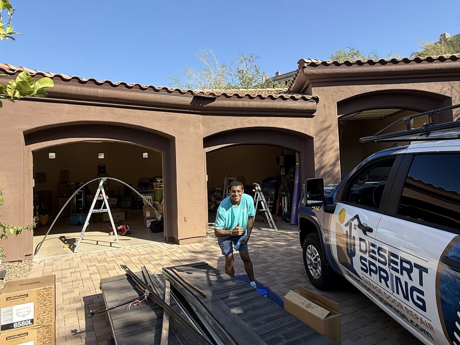 The Desert Spring Garage Door Repair fleet — service van and truck ready for the Valley