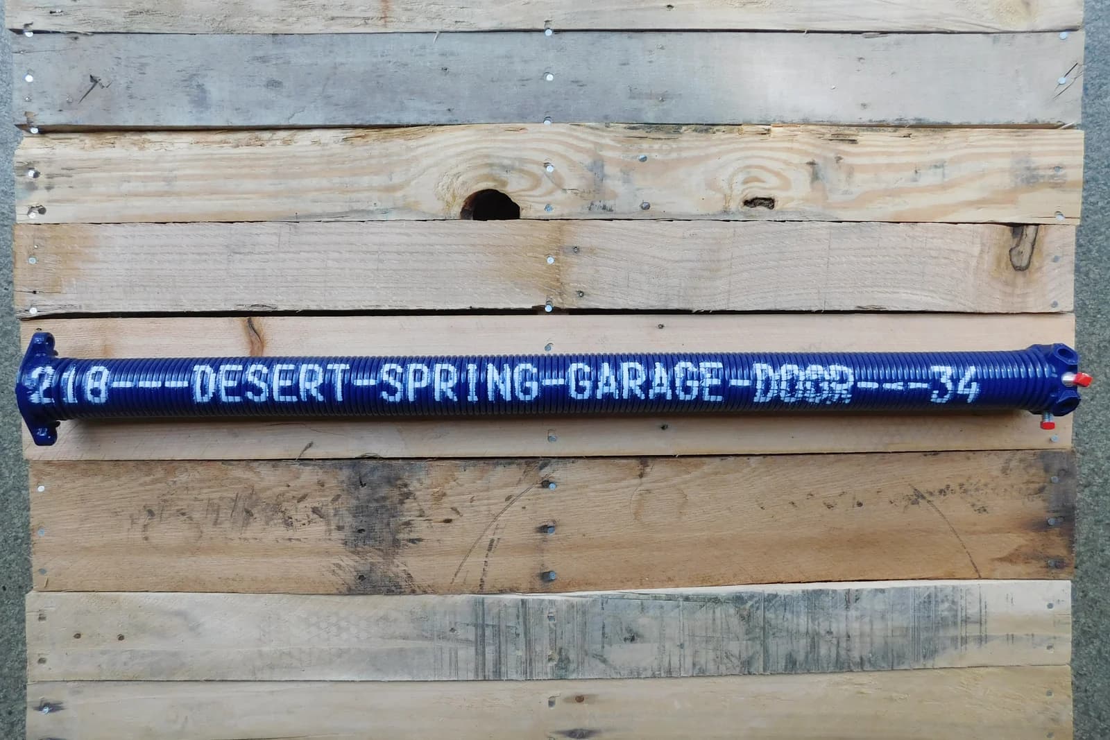 A Desert Spring Garage Door Repair torsion spring, the kind affected by extreme heat in Phoenix, AZ