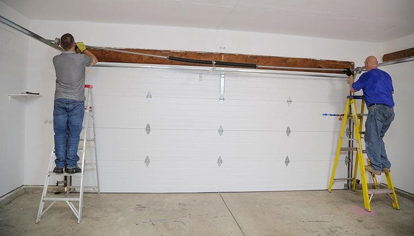 Professional garage door installation in progress