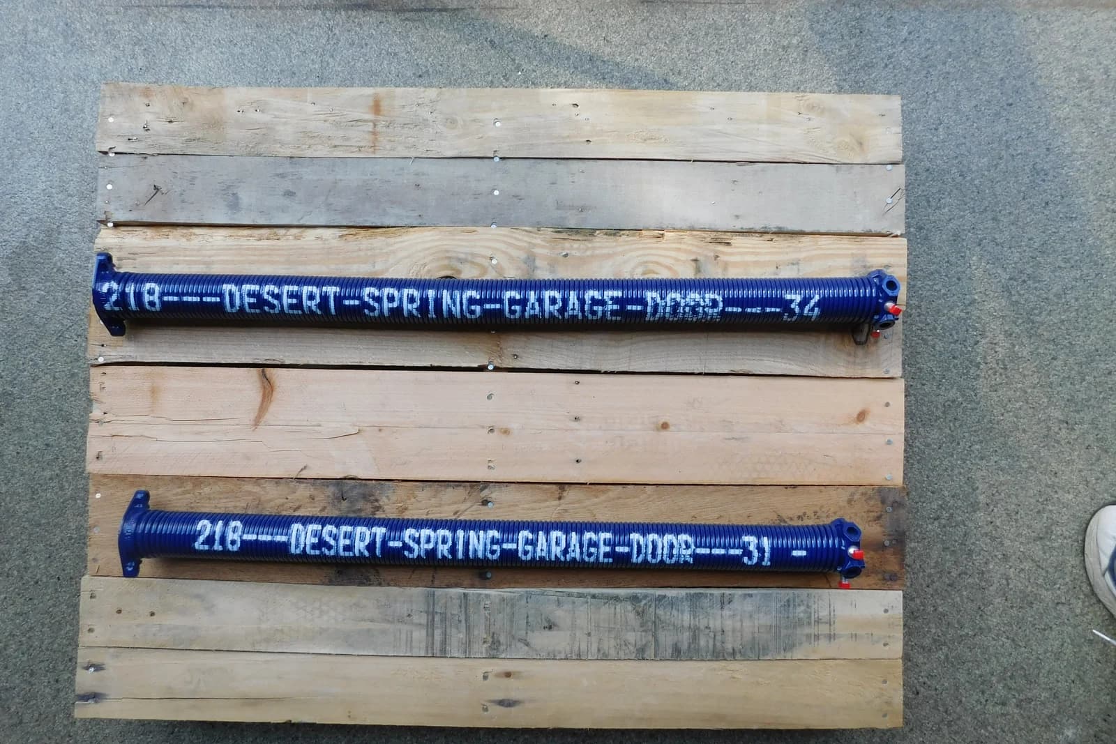 Branded Desert Spring torsion springs ready to replace a Wayne Dalton TorqueMaster system in Phoenix, AZ