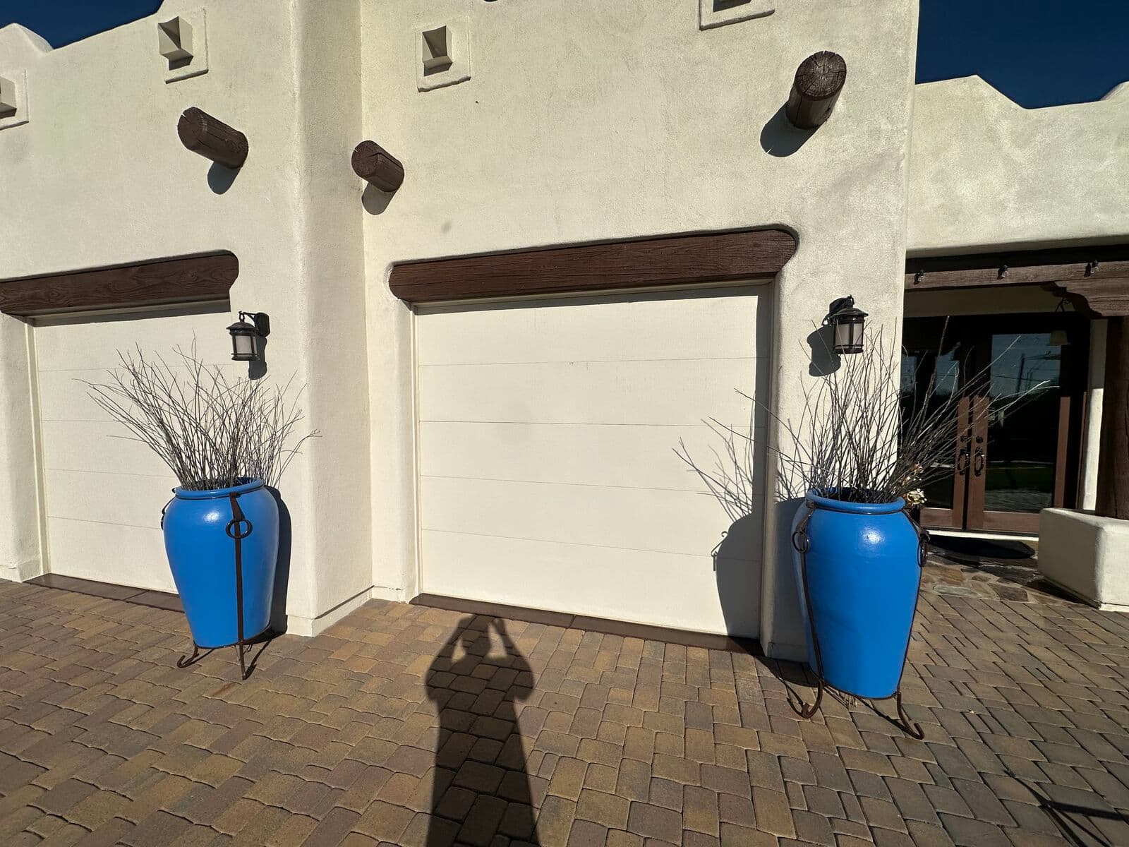 Old solid white raised-panel garage doors before the full-view upgrade, North Valley, Phoenix AZ