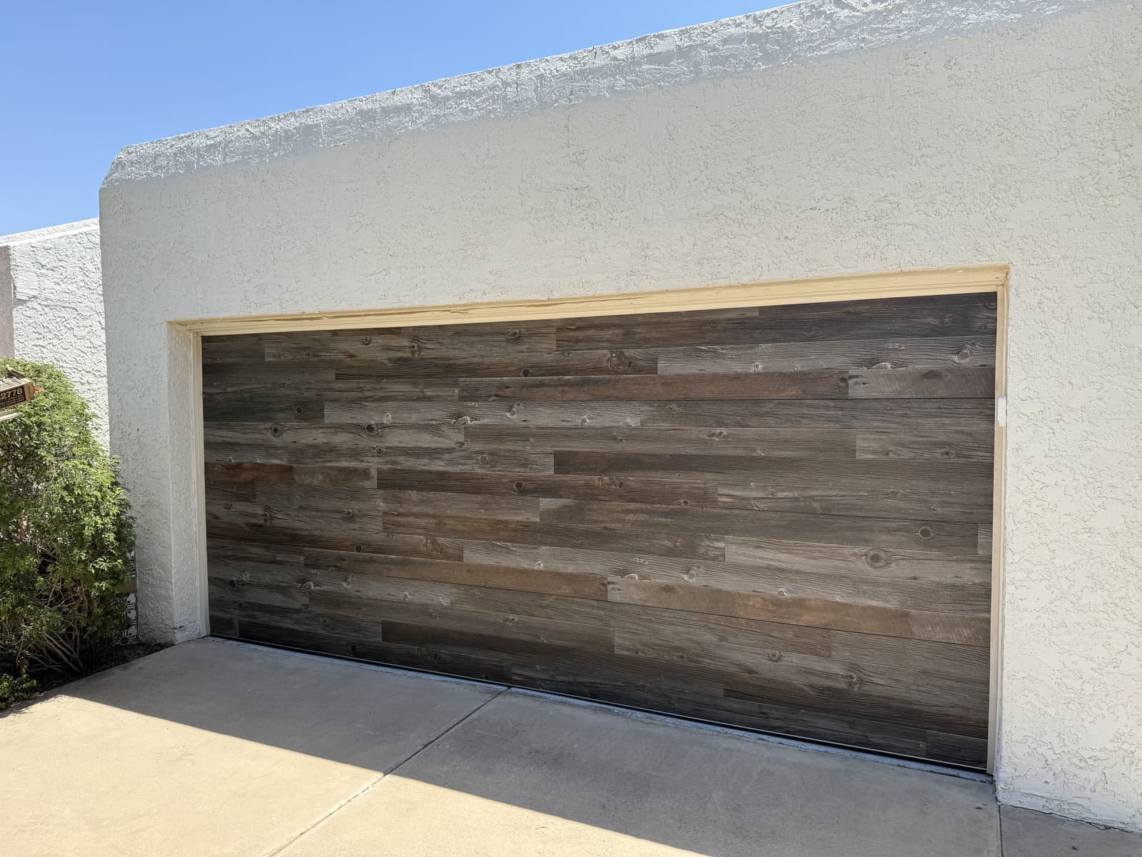 New wood-look garage door installation in Scottsdale, AZ by Desert Spring Garage Door Repair
