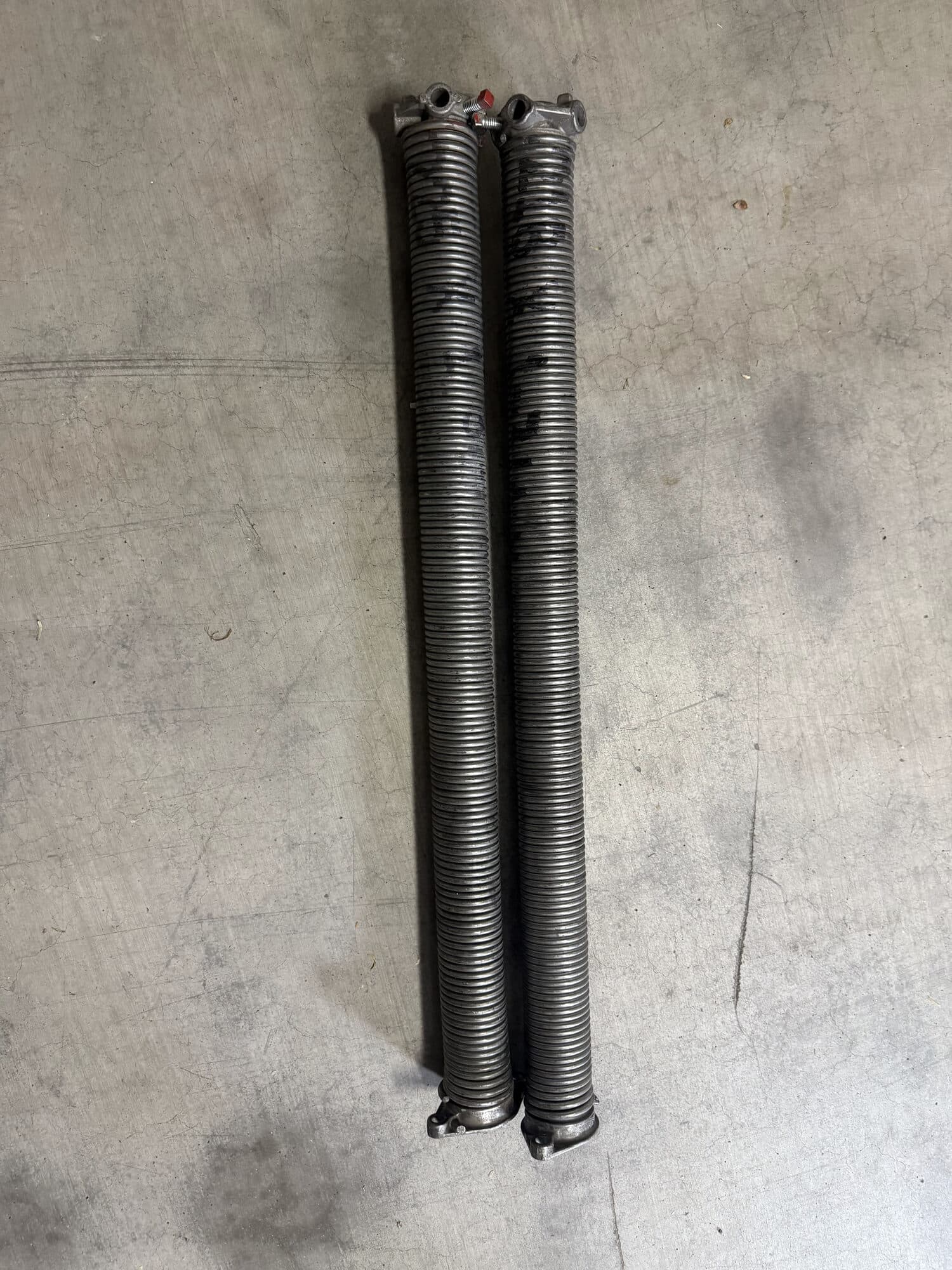 The undersized, wrong-size garage door torsion springs that overloaded the opener, Phoenix AZ