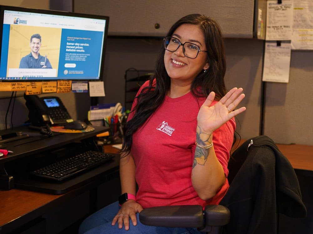 A friendly Desert Spring team member at the front desk, ready to take your call