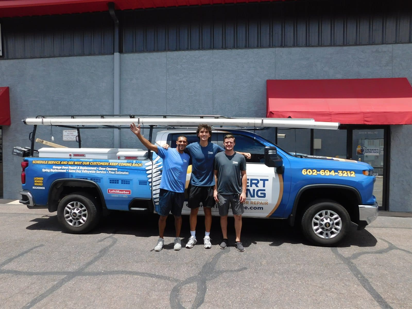 The Desert Spring crew at their branded service truck, ready to arrive on time