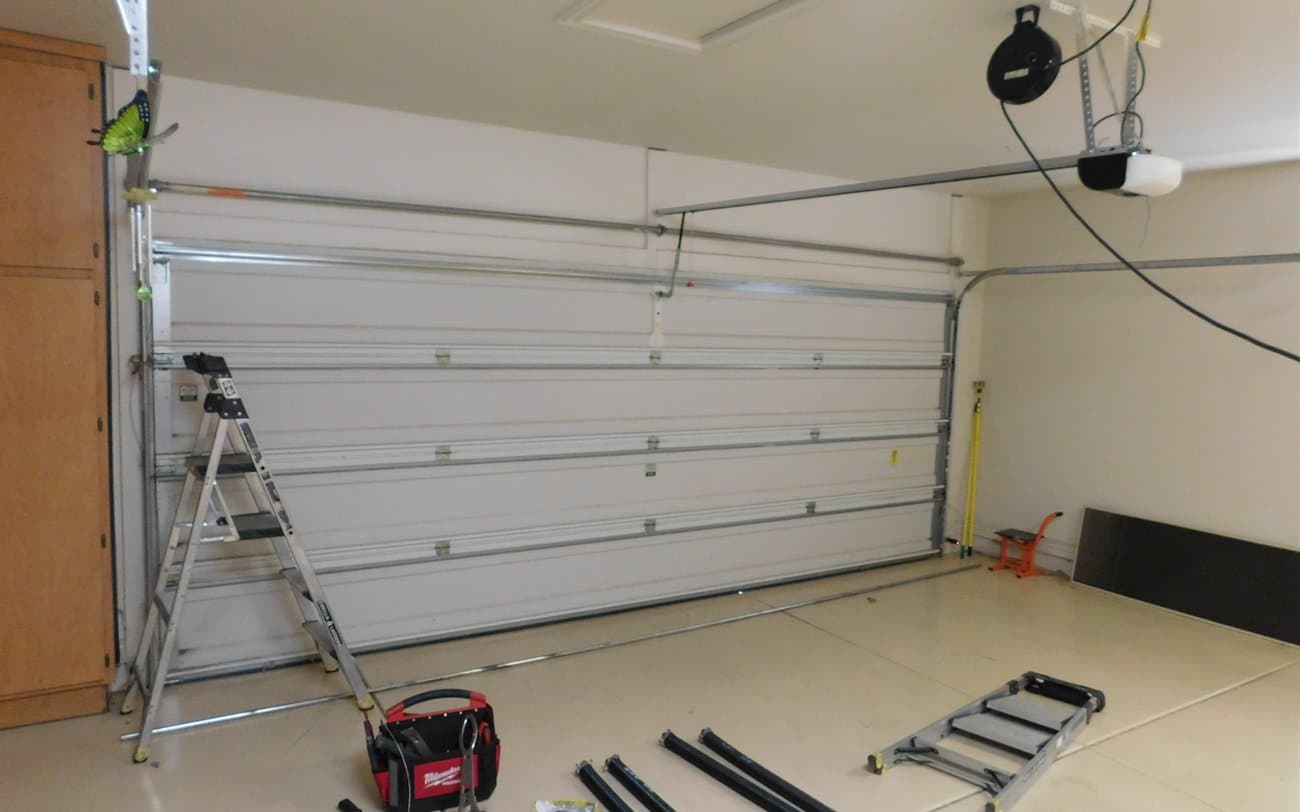 Garage Door Repair Apache Junction Desert Spring technicians repairing a garage door in Apache Junction, AZ
