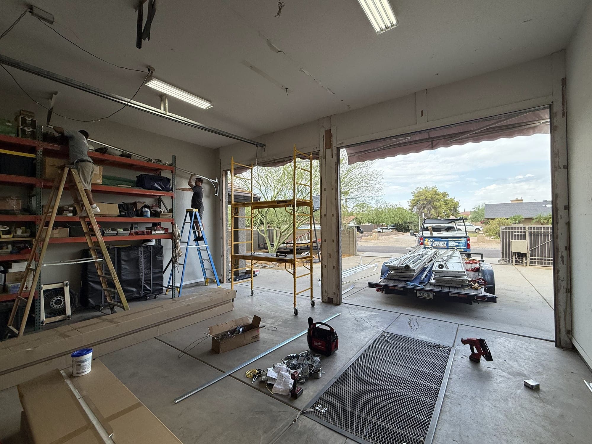 Garage Door Repair & Installation Services in Phoenix, AZ Desert Spring Garage Door Repair crew installing garage doors at a Phoenix, AZ job site