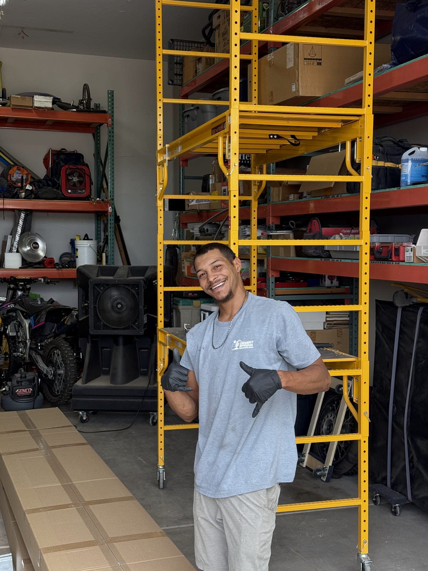 Garage Door Repair Glendale Smiling Desert Spring garage door technician on a job in Glendale, AZ