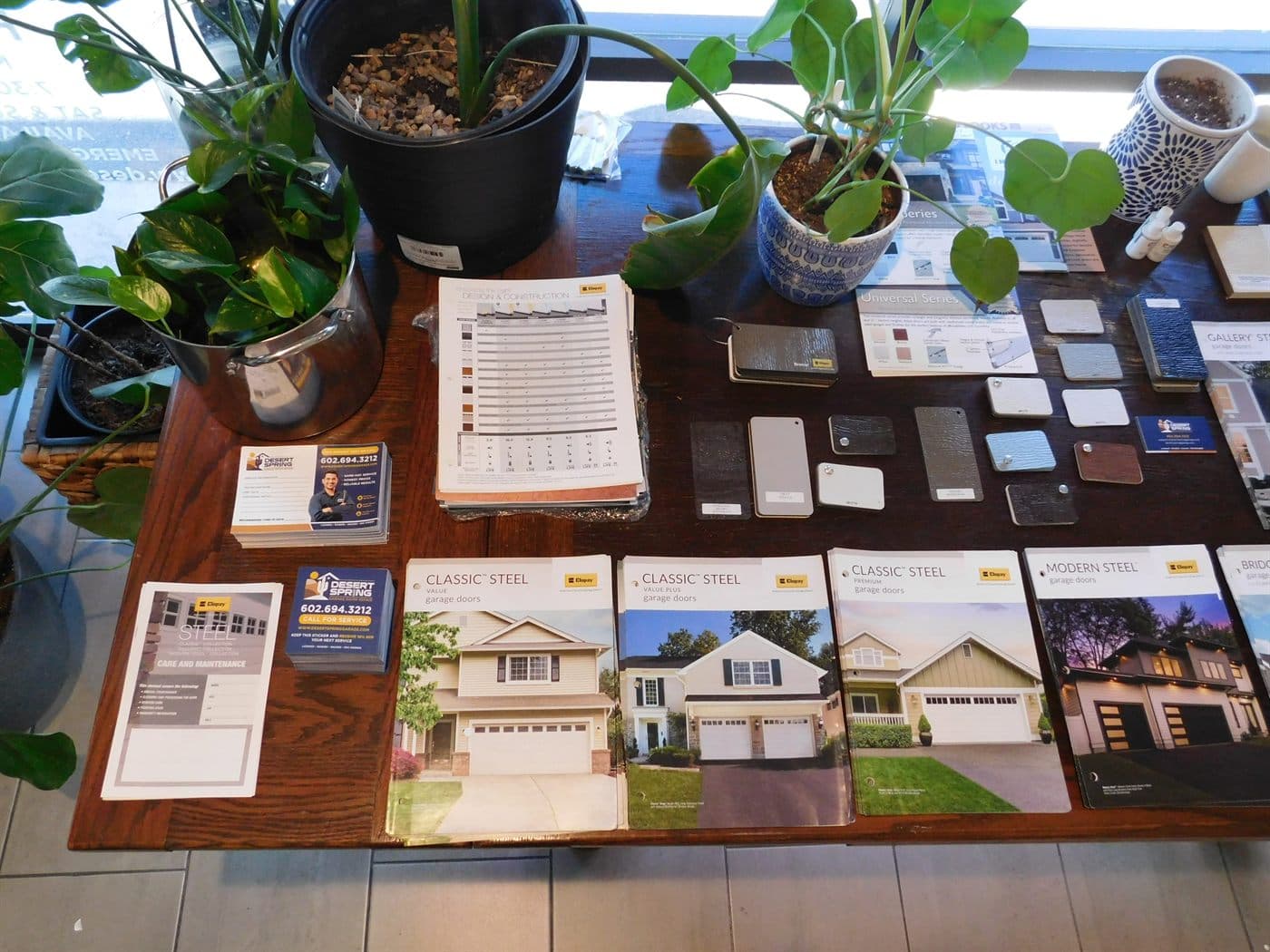 Clopay garage door catalogs showing door styles and color options at the Desert Spring shop