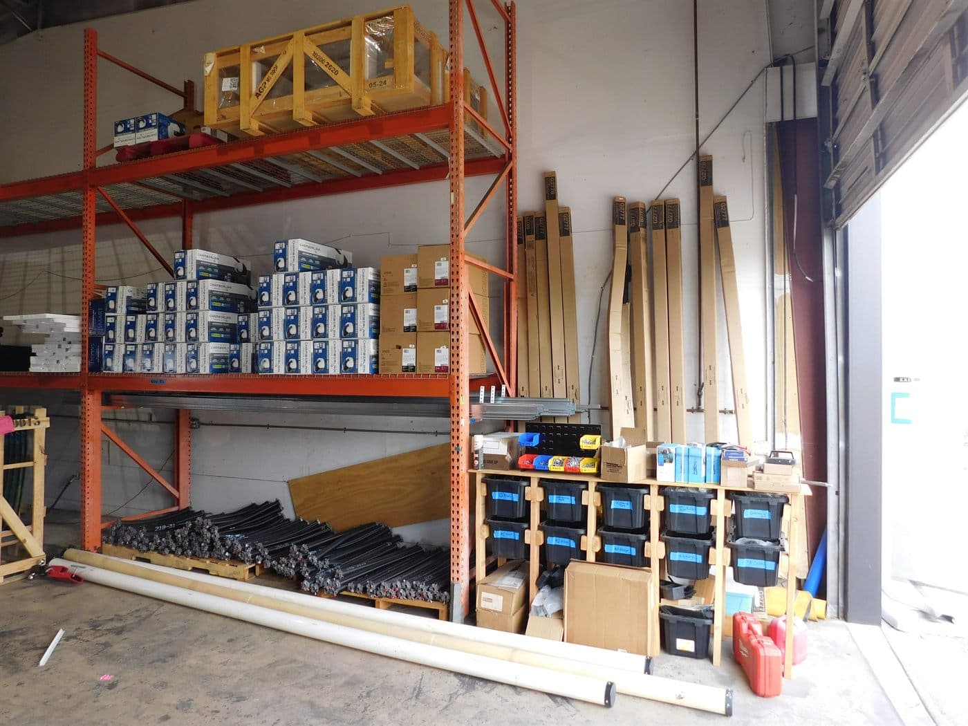 Desert Spring warehouse stocked with garage door springs, rollers, and replacement parts